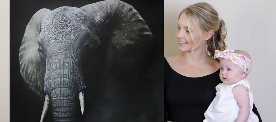 Carla Grace Wild life Artist, blond woman holding a baby next to painting of an elephant
