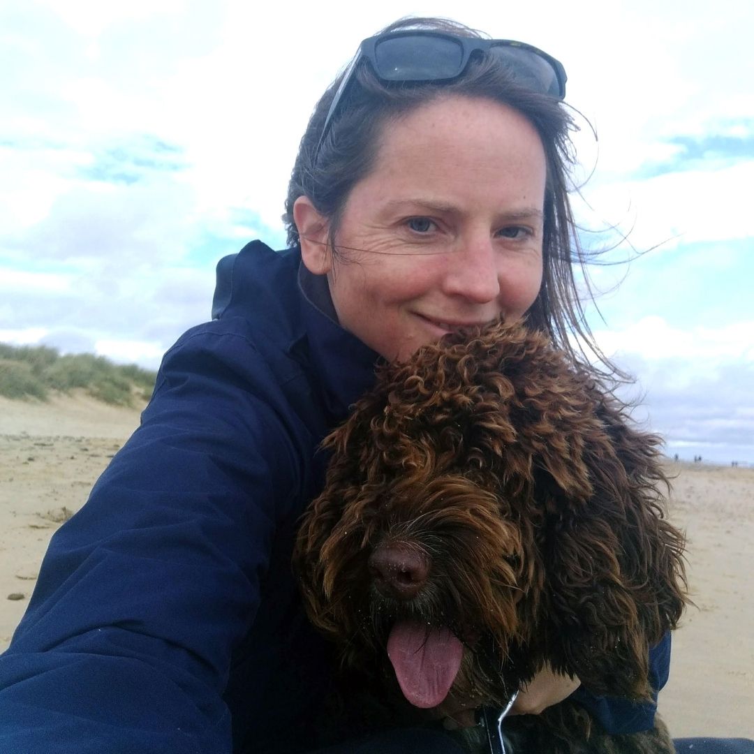 Art Therapist Amy Jeans and her dog at the beach